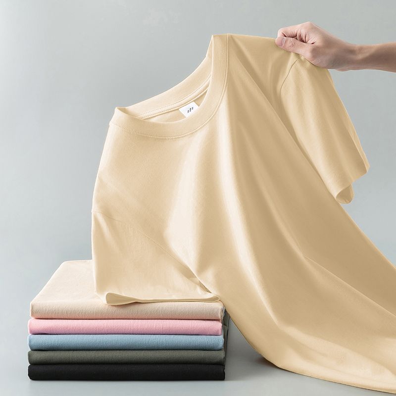 Camiseta de verano de color liso con cuello redondo y manga corta de algodón puro para hombre y mujer.