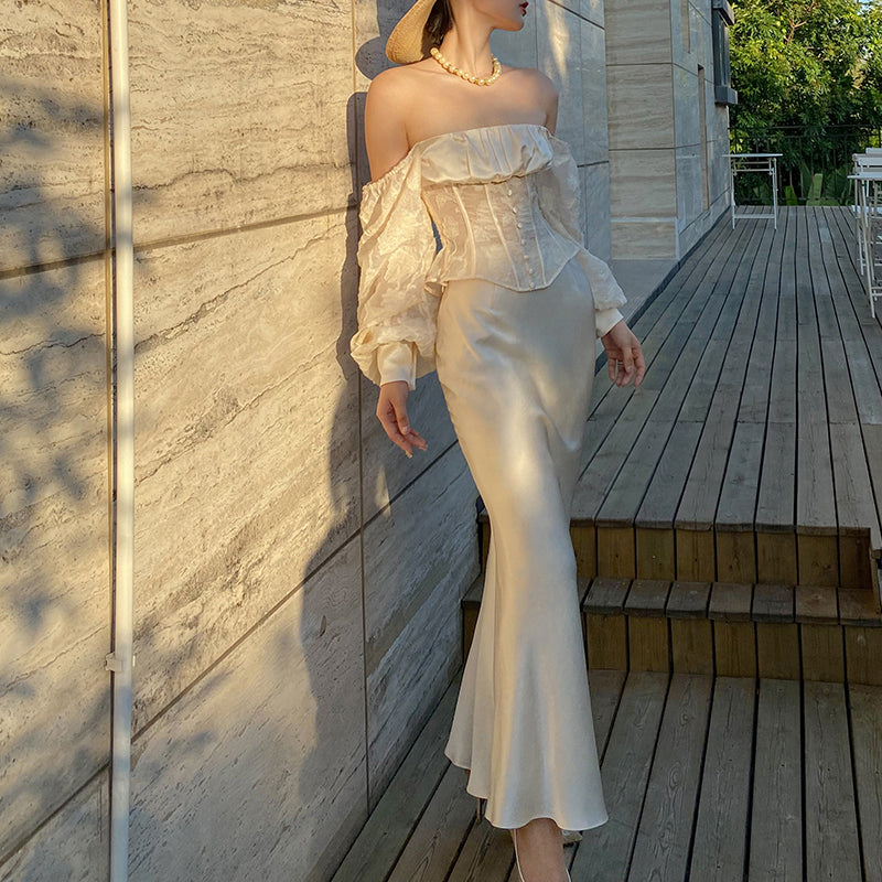 Camisa de jacquard de un solo hombro Xiaoli Qimeng, nueva camisa de primavera con diseño francés Sense Niche de manga larga para mujer