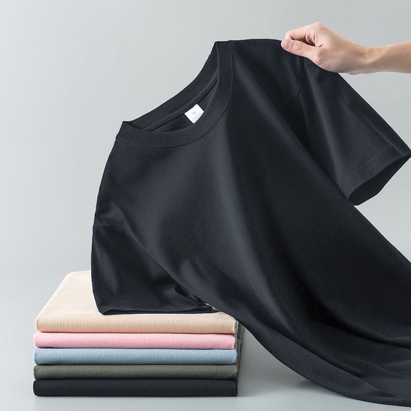 Camiseta de verano de color liso con cuello redondo y manga corta de algodón puro para hombre y mujer.