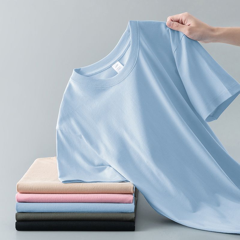 Camiseta de verano de color liso con cuello redondo y manga corta de algodón puro para hombre y mujer.