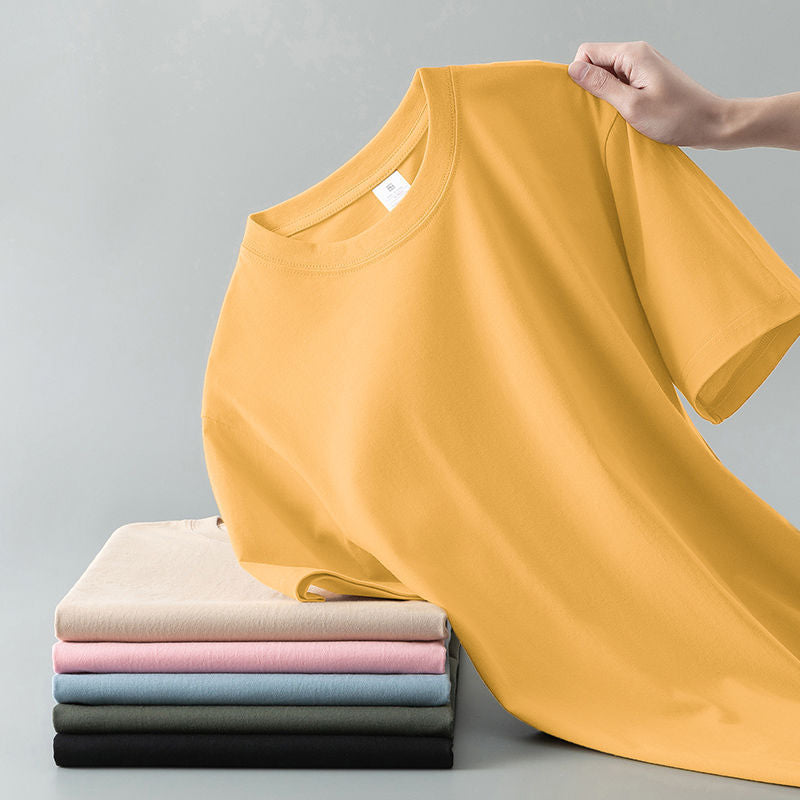 Camiseta de verano de color liso con cuello redondo y manga corta de algodón puro para hombre y mujer.