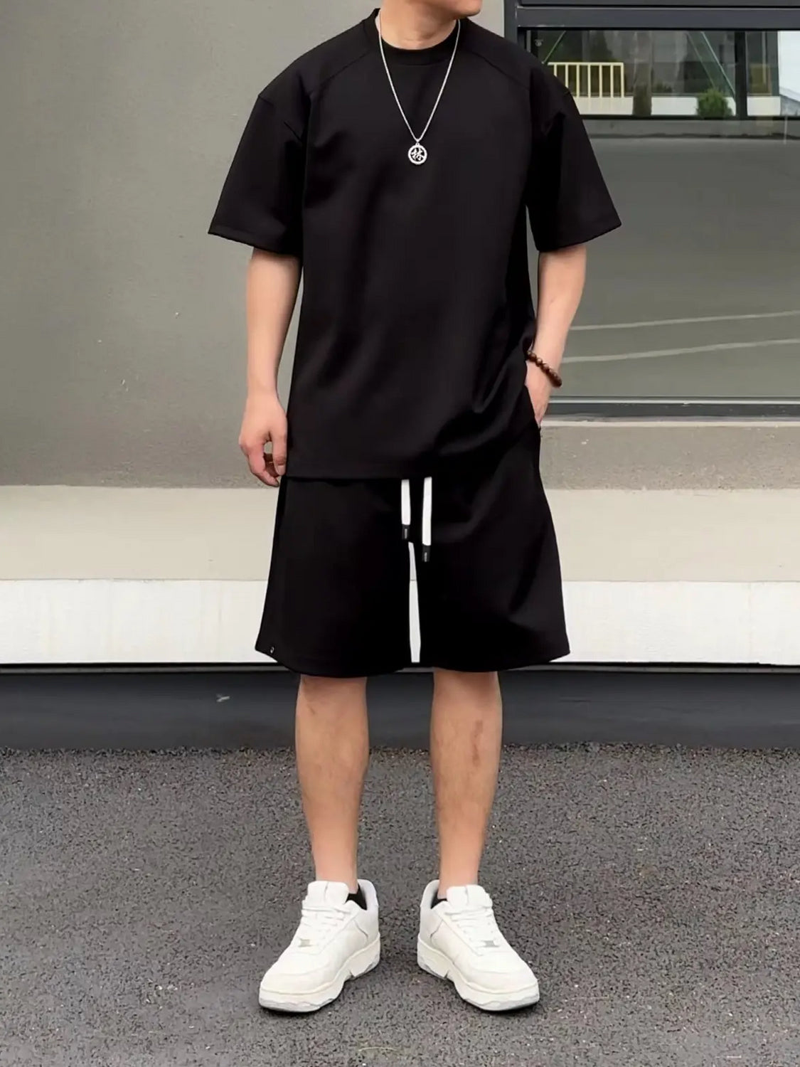 Traje de dos piezas sencillo y holgado con pantalones cortos de manga corta para pareja