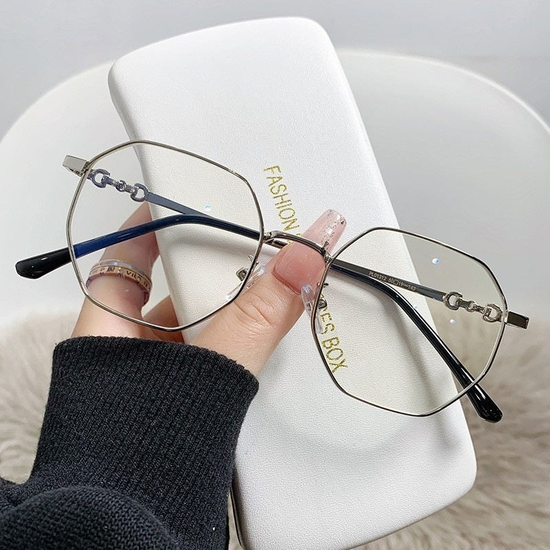 Gafas de mujer anti-luz azul con montura poligonal sin marco en oro rosa