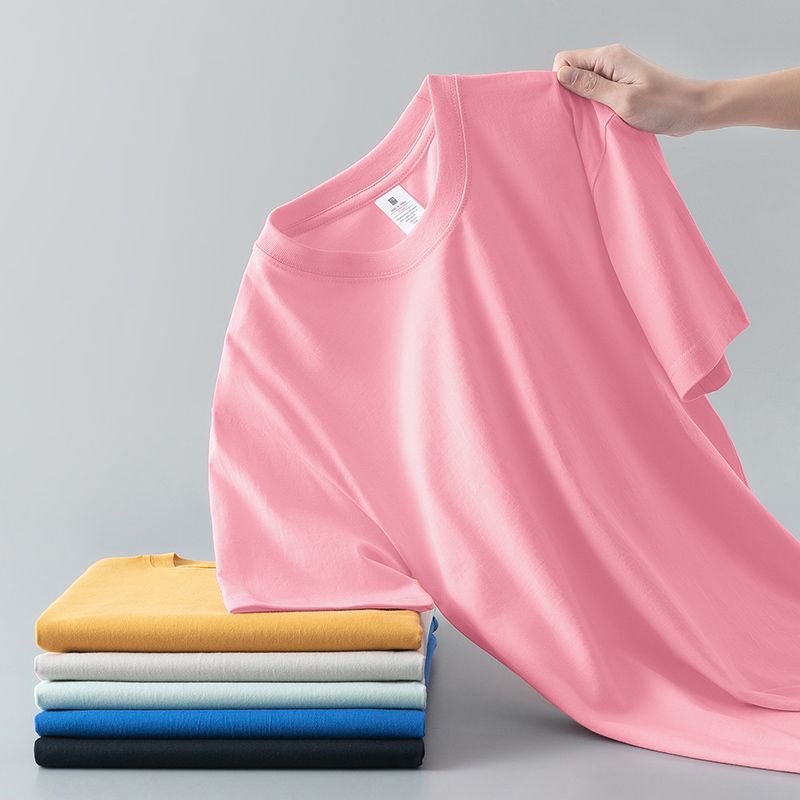 Camiseta de verano de color liso con cuello redondo y manga corta de algodón puro para hombre y mujer.