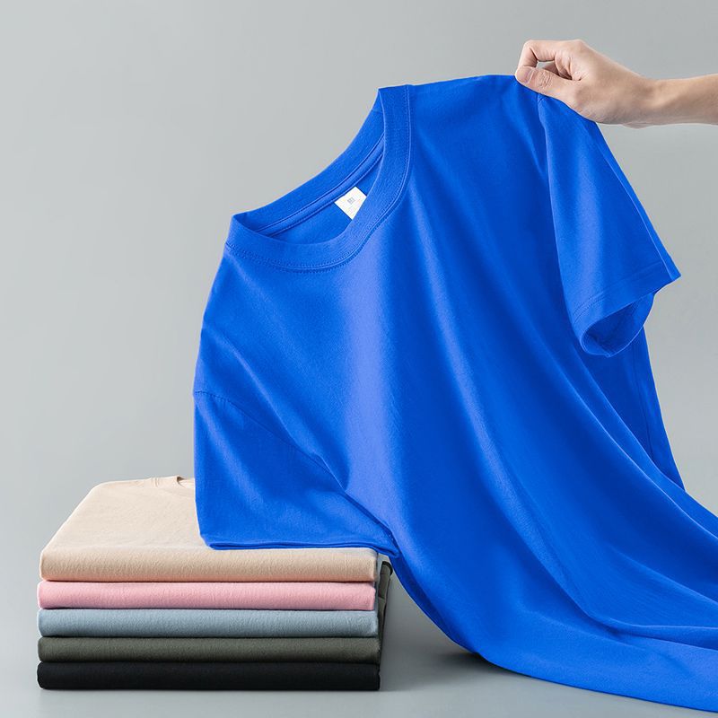 Camiseta de verano de color liso con cuello redondo y manga corta de algodón puro para hombre y mujer.