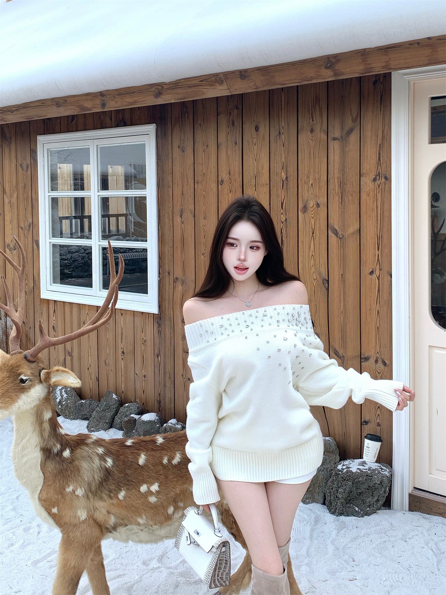 Suéter de manga larga muy adornado con pedrería