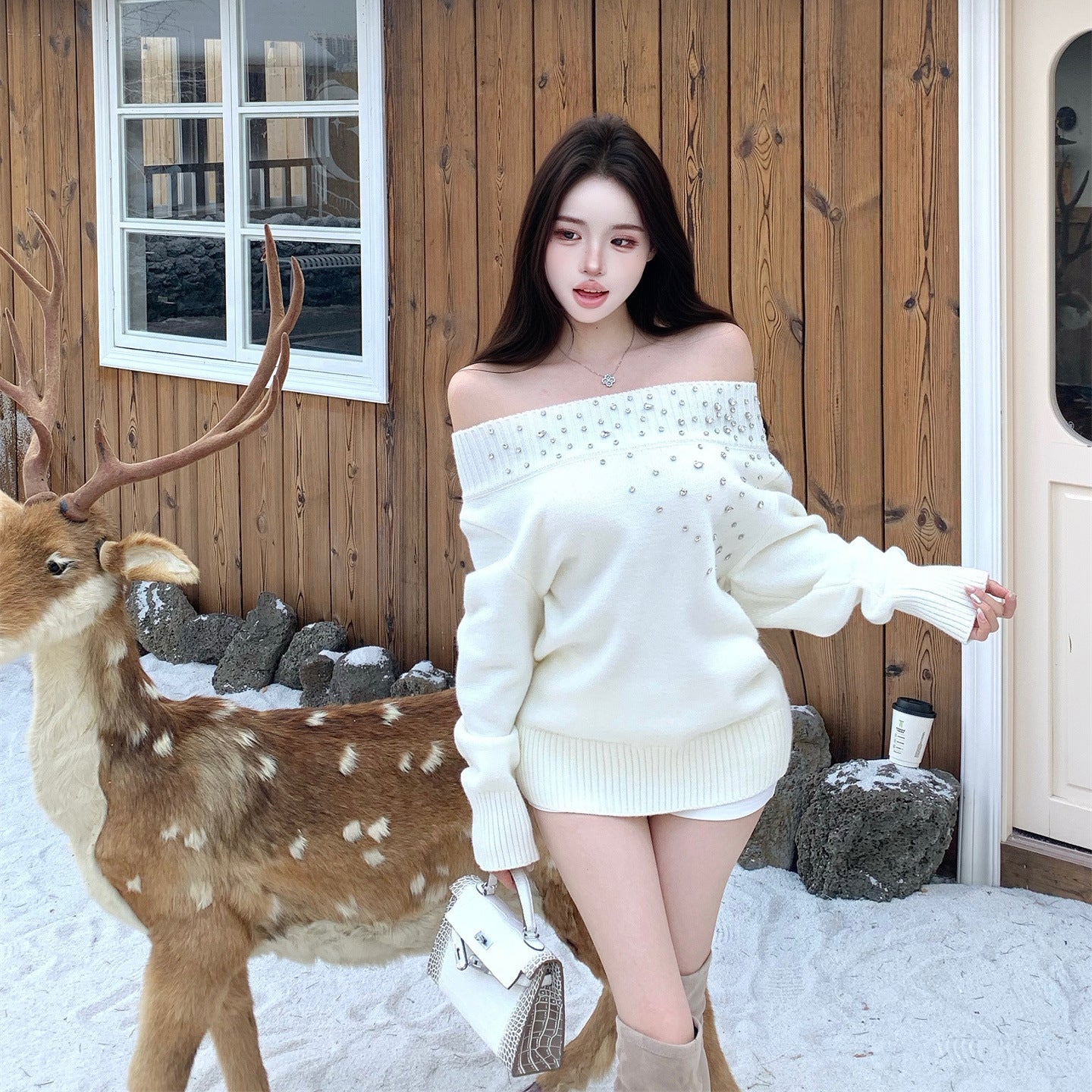 Suéter de manga larga muy adornado con pedrería